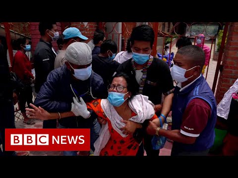 Families in Nepal forced to say goodbye through crematorium gates – BBC News