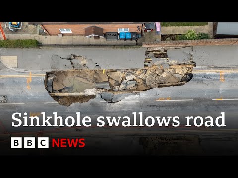 Major incident declared over sinkhole swallowing up UK street | BBC News