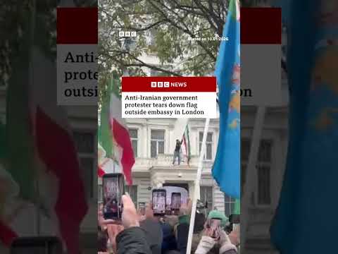 Anti-Iranian government protester tears down flag outside embassy in London. #Iran #London #BBCNews