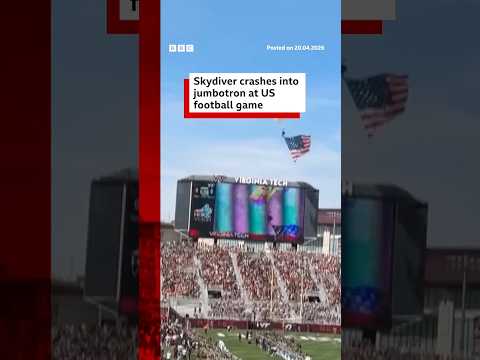 Skydiver crashes into jumbotron at US football game. #Virginia #BBCNews