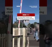 Warning issued after woman and child dash over level crossing. #England #BBCNews