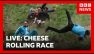LIVE: Cheese rolling races get off to spectacular start | BBC News
